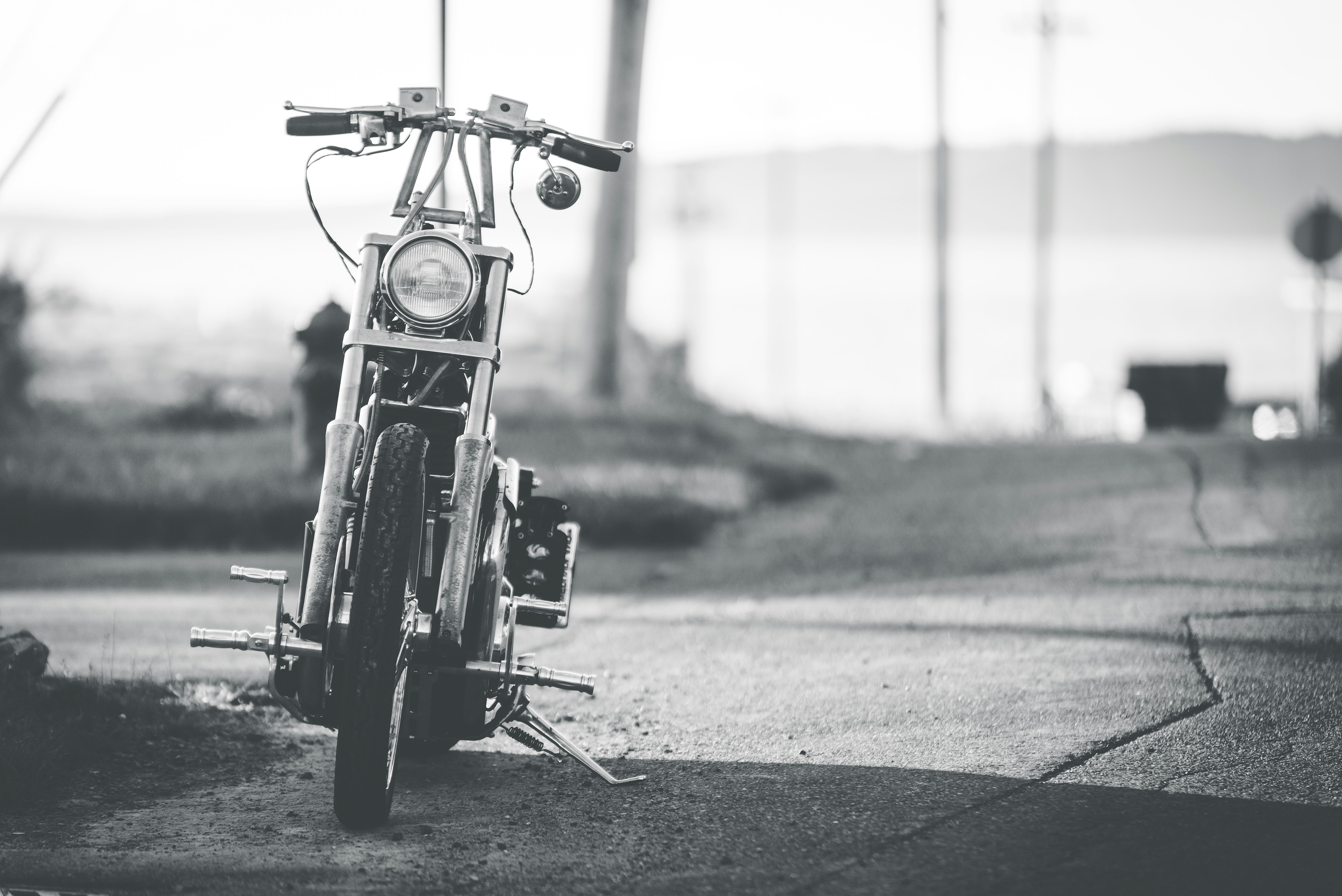 black motorcycle on gray asphalt road during daytime